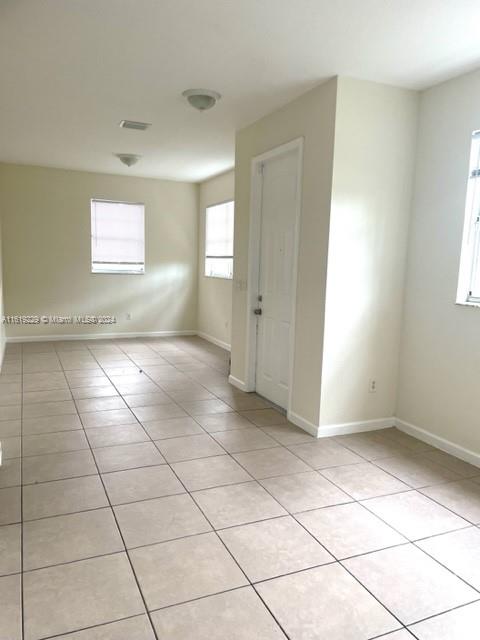 2133 Northeast 7th Street, Unit 2133 Homestead, FL 33033 - Photo 23 of 28 a view of an empty room with a window