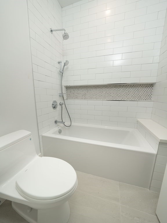 21 Cavanaugh Path Newton, MA 02459 - Photo 19 of 30 a bathroom with a white bath tub and a shower
