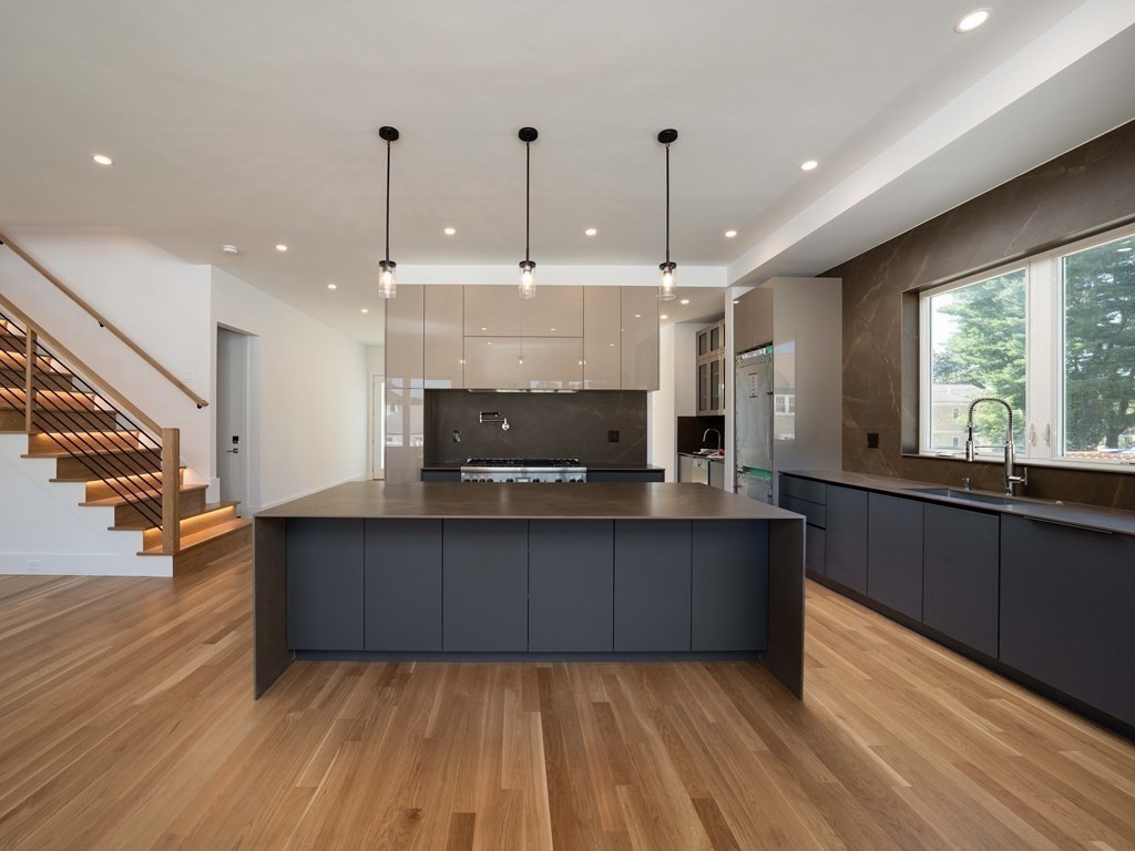 21 Cavanaugh Path Newton, MA 02459 - Photo 2 of 30 a large kitchen with wooden floor and a sink