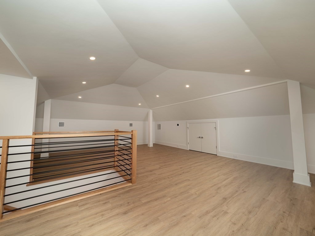 21 Cavanaugh Path Newton, MA 02459 - Photo 22 of 30 a view of empty room with wooden floor