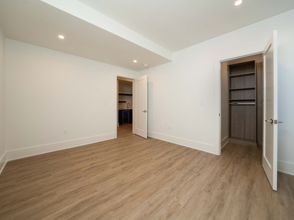 21 Cavanaugh Path Newton, MA 02459 - Photo 27 of 30 a view of an empty room with wooden floor and closet
