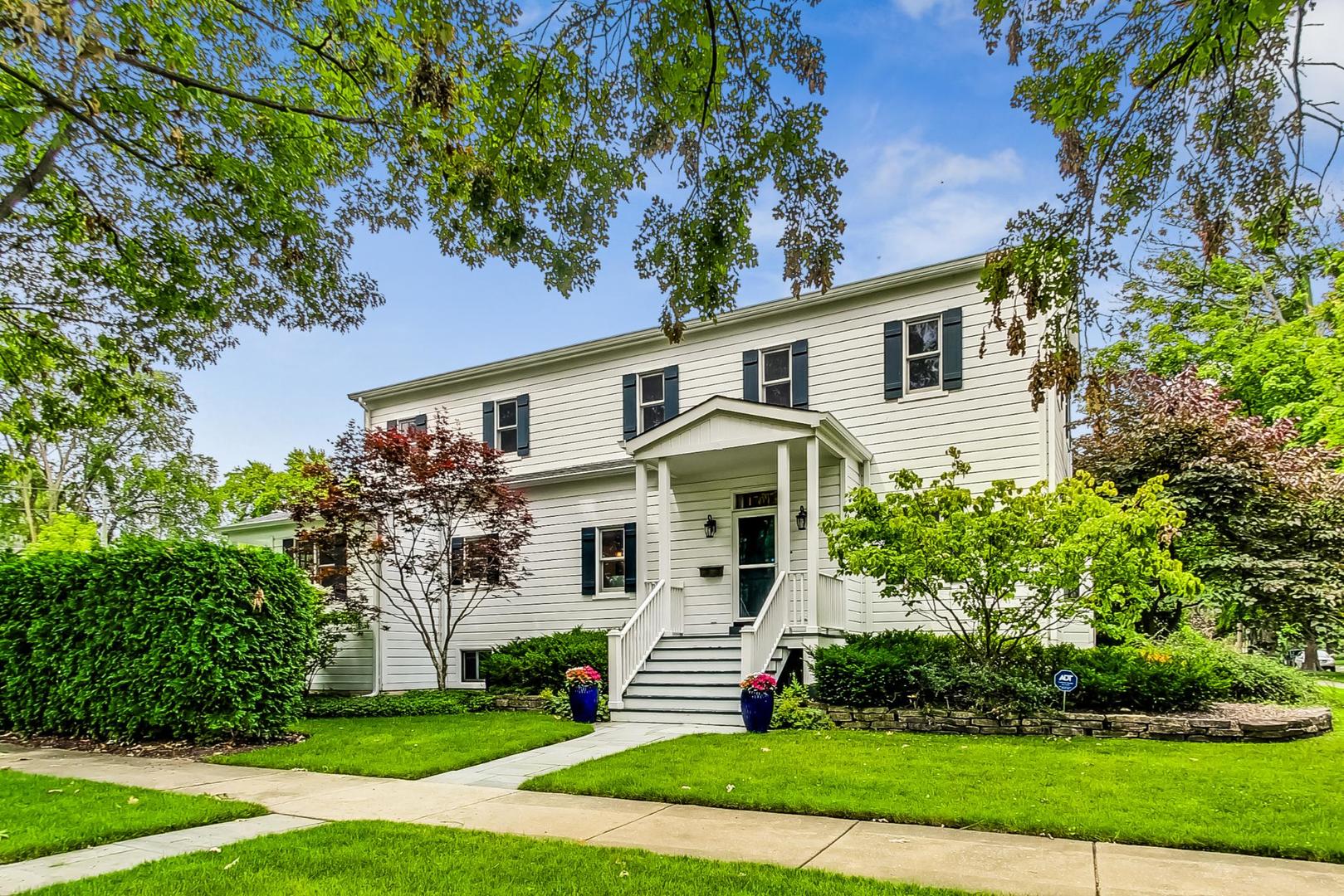 1701 Walnut Avenue Wilmette, IL 60091 - Photo 1 of 30 a front view of a house with a yard