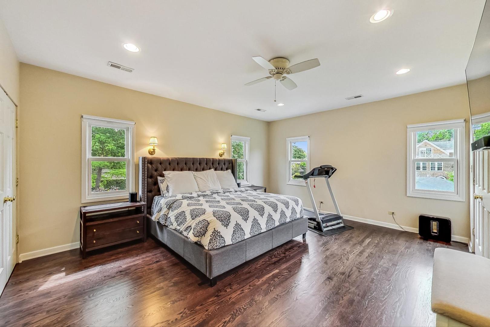 1701 Walnut Avenue Wilmette, IL 60091 - Photo 14 of 30 a bedroom with a bed and a flat screen tv