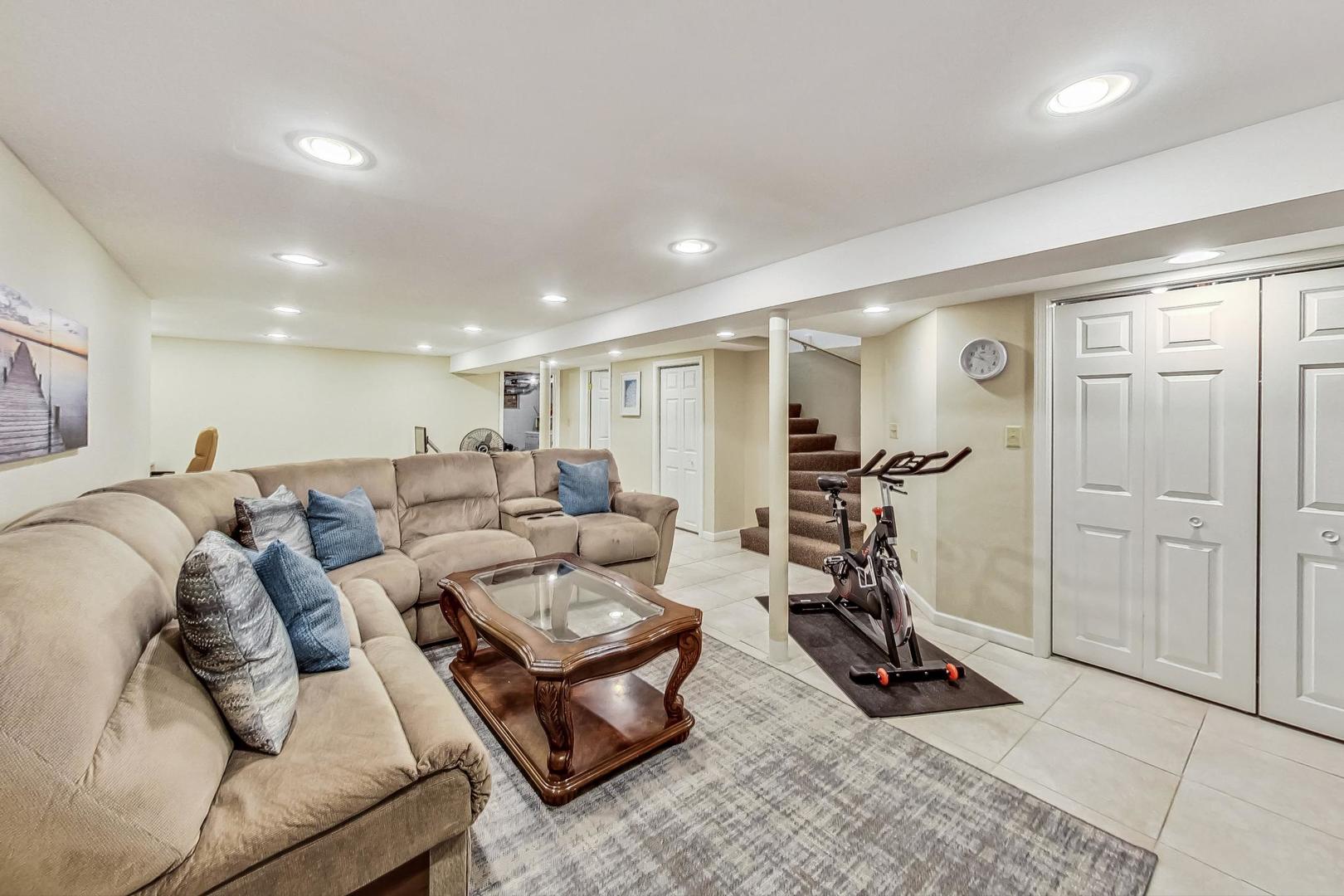 1701 Walnut Avenue Wilmette, IL 60091 - Photo 23 of 30 a living room with furniture a wooden floor and a table