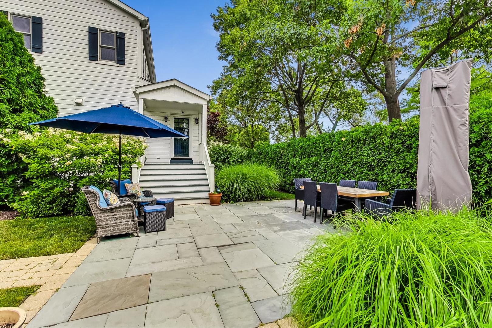 1701 Walnut Avenue Wilmette, IL 60091 - Photo 28 of 30 a view of backyard with table and chairs and potted plants