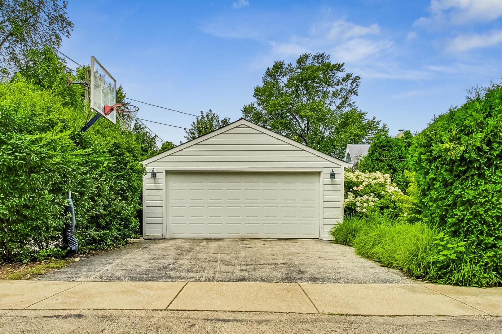 1701 Walnut Avenue Wilmette, IL 60091 - Photo 30 of 30 a front view of a house with a garage