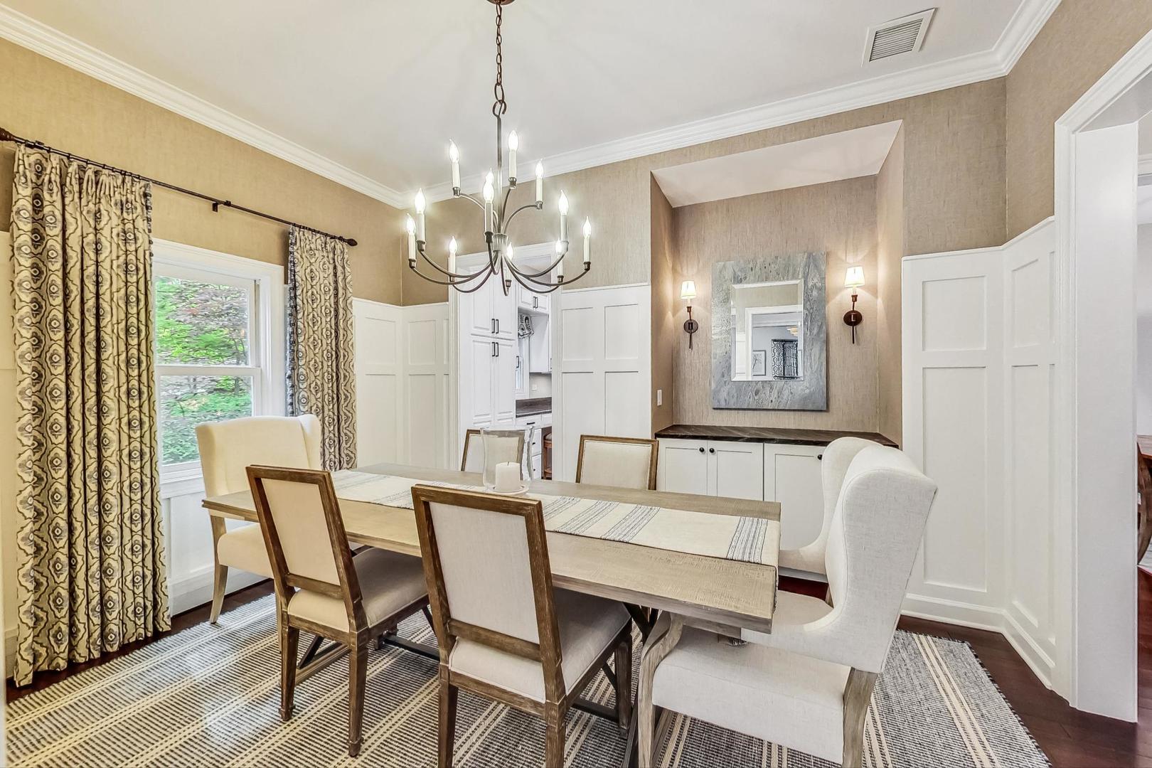 1701 Walnut Avenue Wilmette, IL 60091 - Photo 6 of 30 a view of a dining room with furniture and chandelier