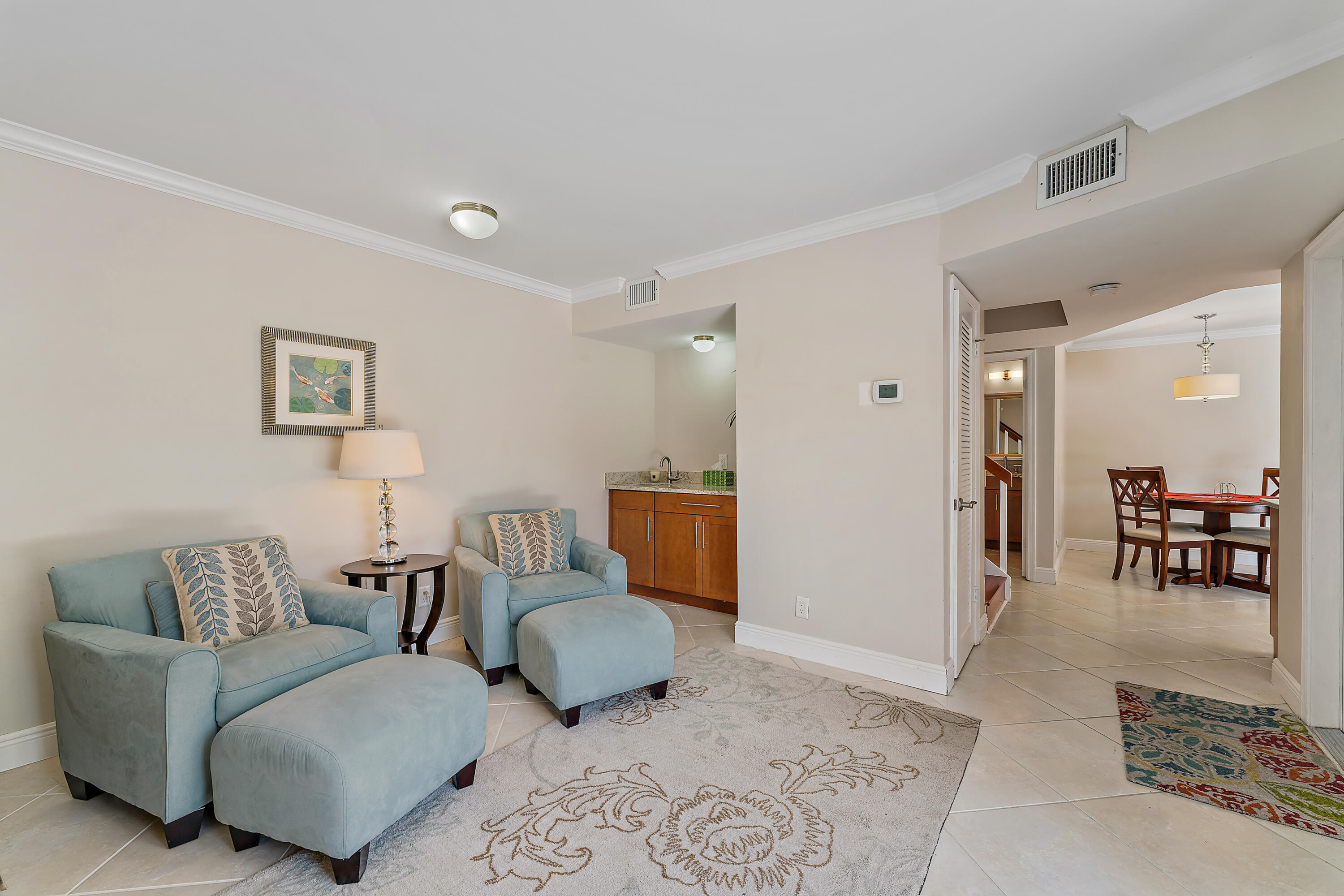 1420 Ocean Way, Unit 14C Jupiter, FL 33477 - Photo 12 of 41 a living room with furniture and a couch