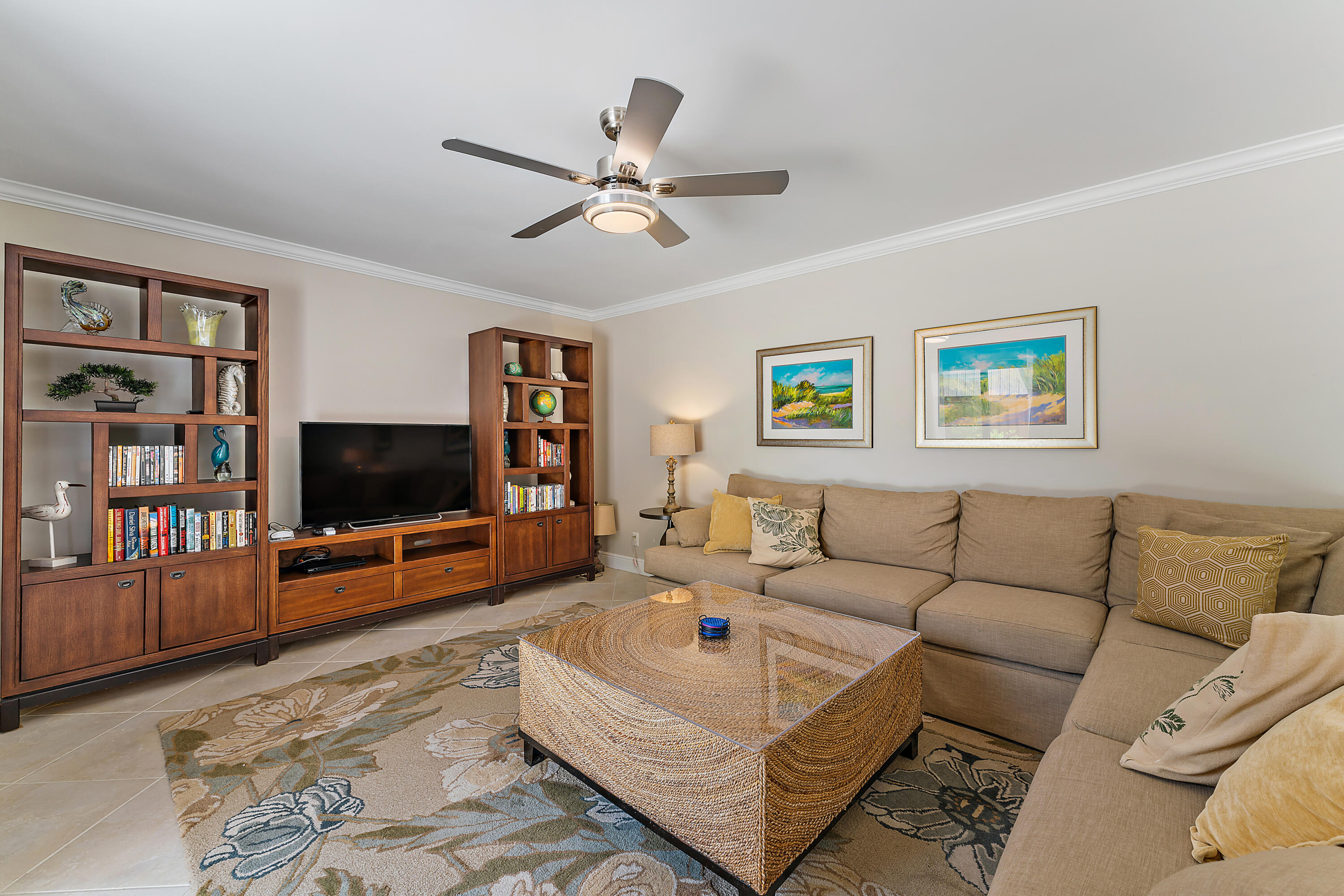 1420 Ocean Way, Unit 14C Jupiter, FL 33477 - Photo 13 of 41 a living room with furniture and a flat screen tv