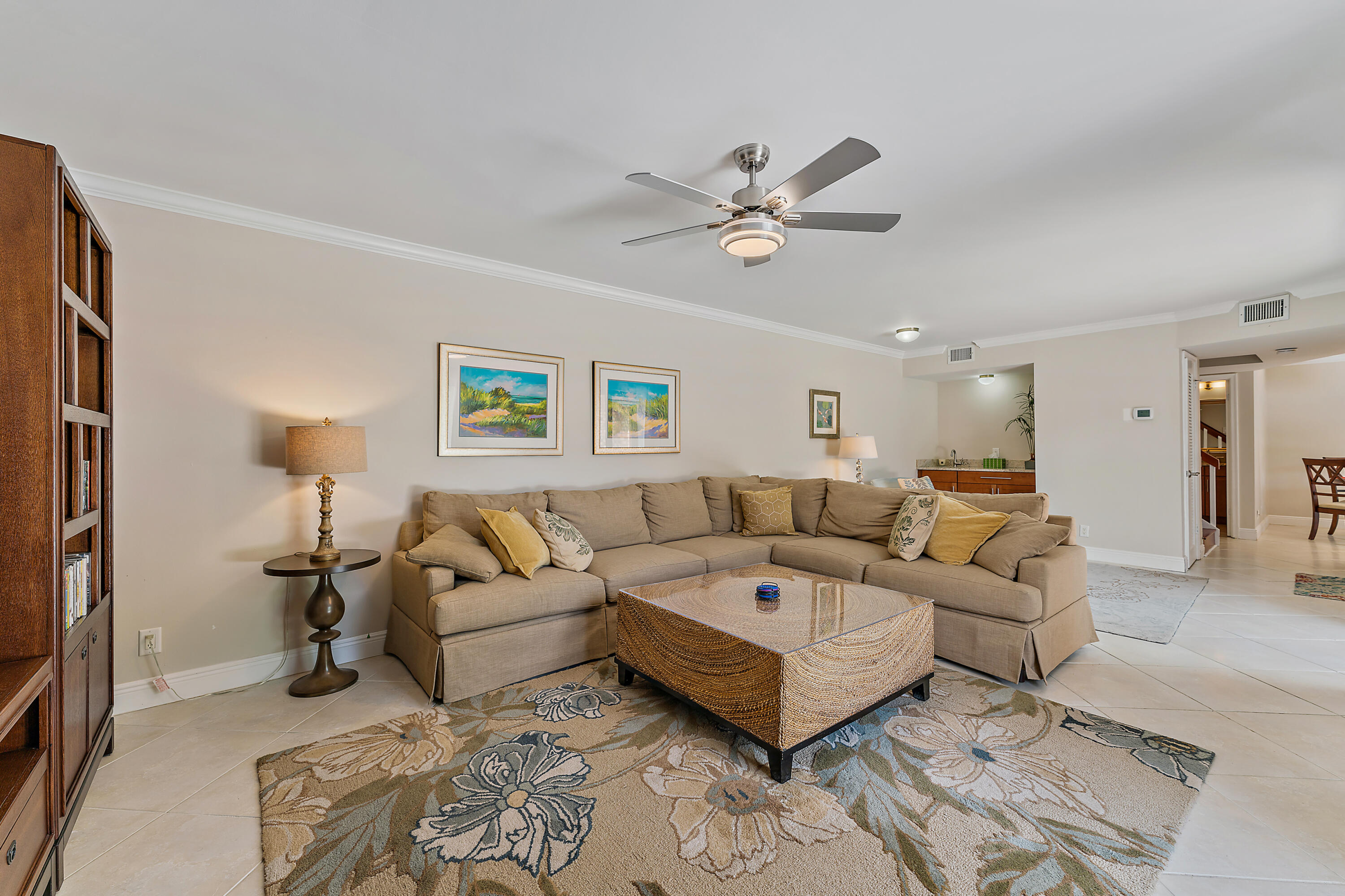 1420 Ocean Way, Unit 14C Jupiter, FL 33477 - Photo 14 of 41 a living room with furniture and a ceiling fan