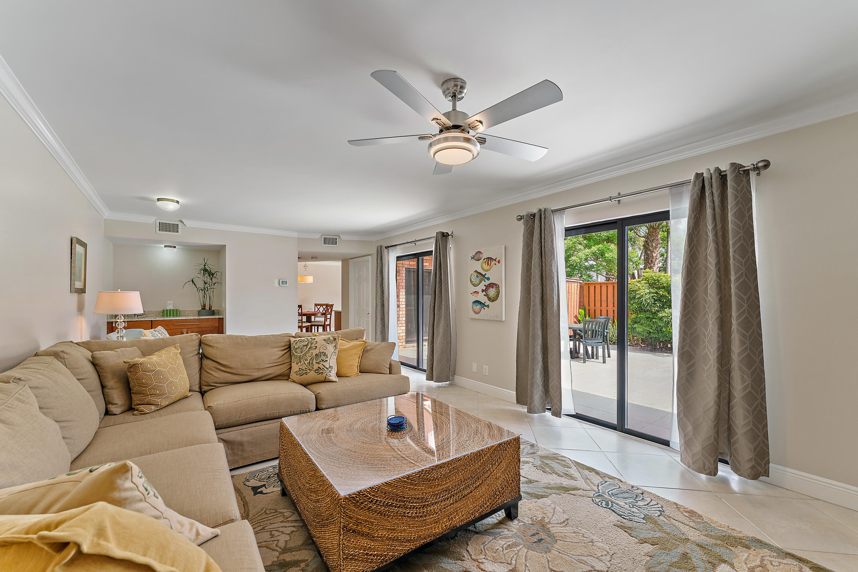 1420 Ocean Way, Unit 14C Jupiter, FL 33477 - Photo 15 of 41 a living room with furniture and a window