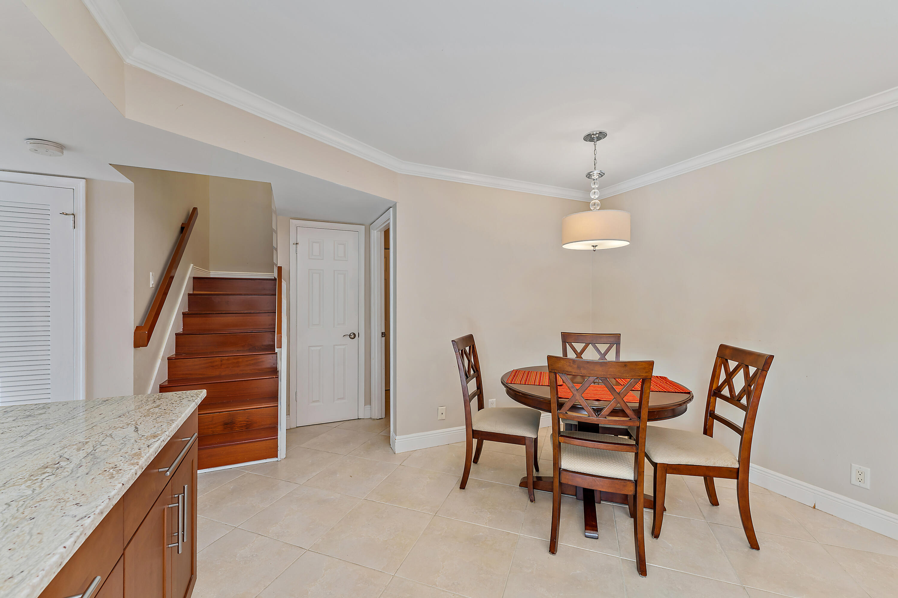 1420 Ocean Way, Unit 14C Jupiter, FL 33477 - Photo 19 of 41 a view of a dining room with furniture and wooden floor