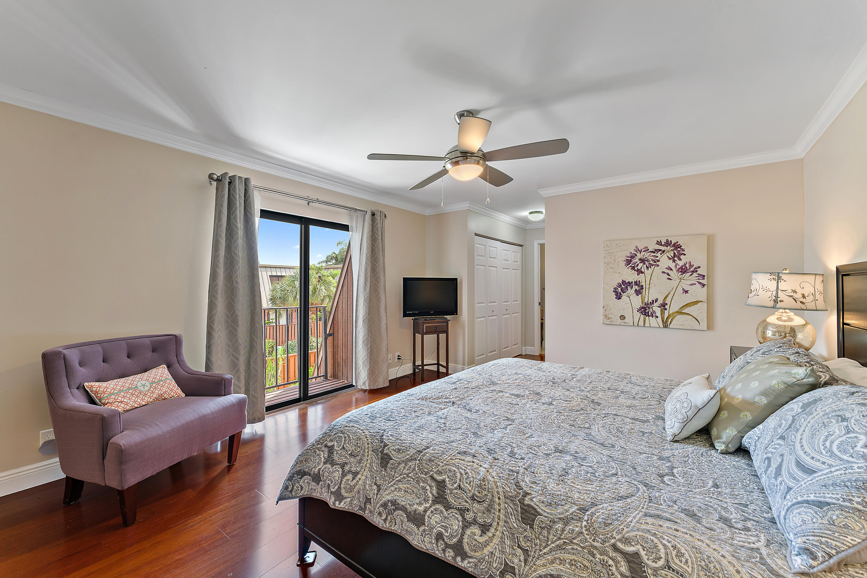1420 Ocean Way, Unit 14C Jupiter, FL 33477 - Photo 26 of 41 a bedroom with a bed and a couch
