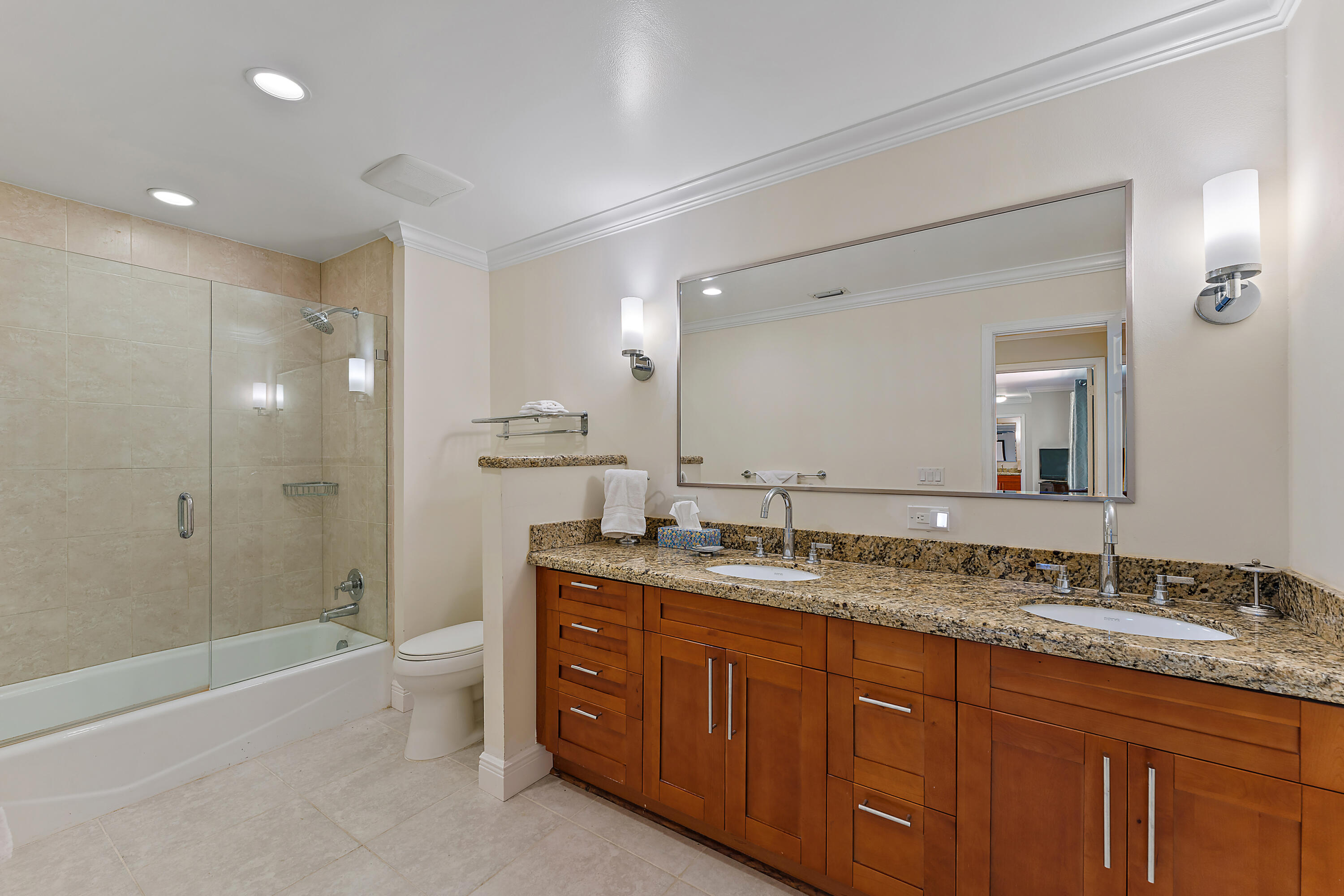 1420 Ocean Way, Unit 14C Jupiter, FL 33477 - Photo 34 of 41 a bathroom with a granite countertop double vanity sink and mirror with shower