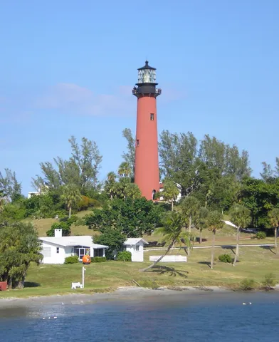 a swimming pool with trees in the background