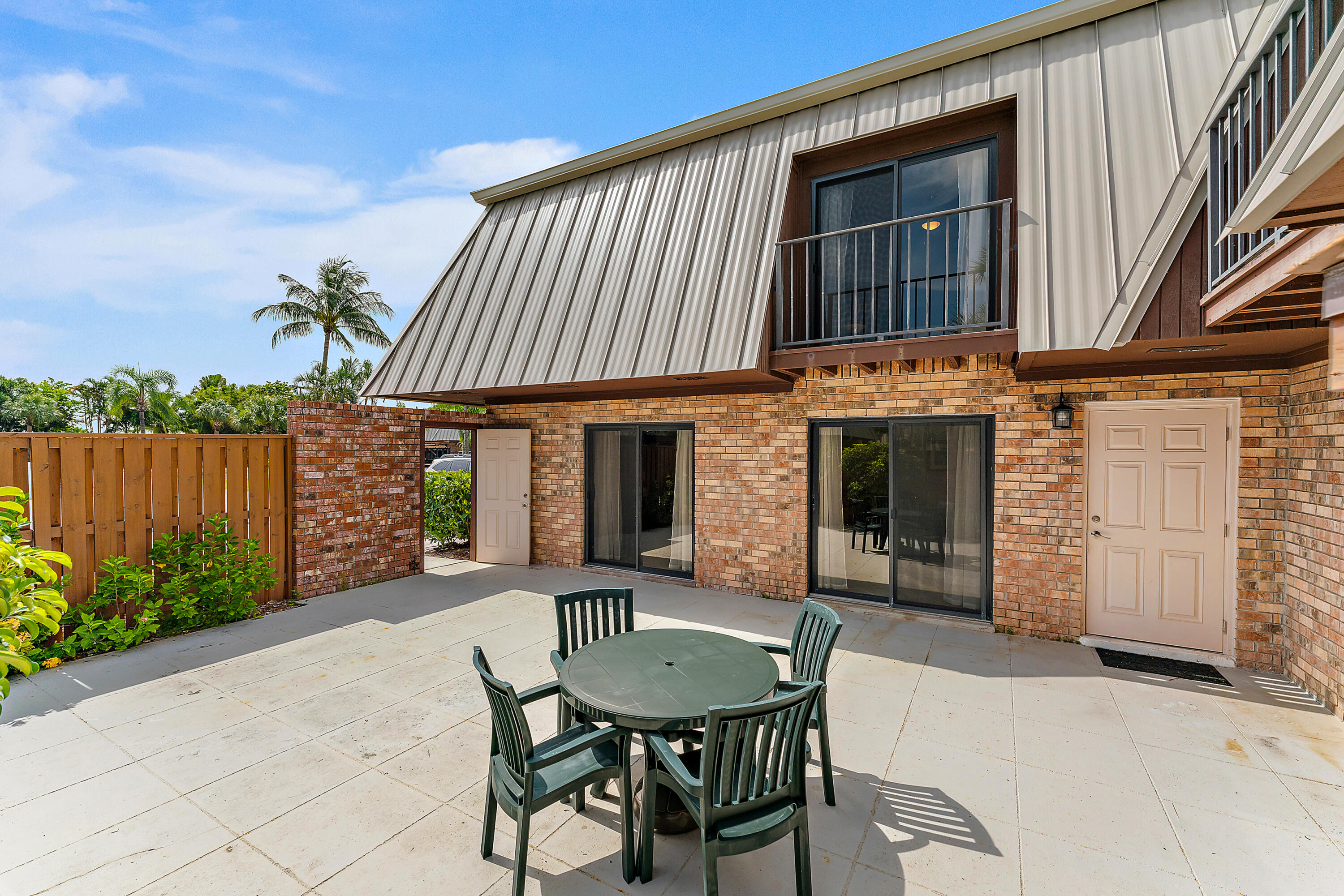 1420 Ocean Way, Unit 14C Jupiter, FL 33477 - Photo 4 of 41 a view of a house with backyard and sitting area