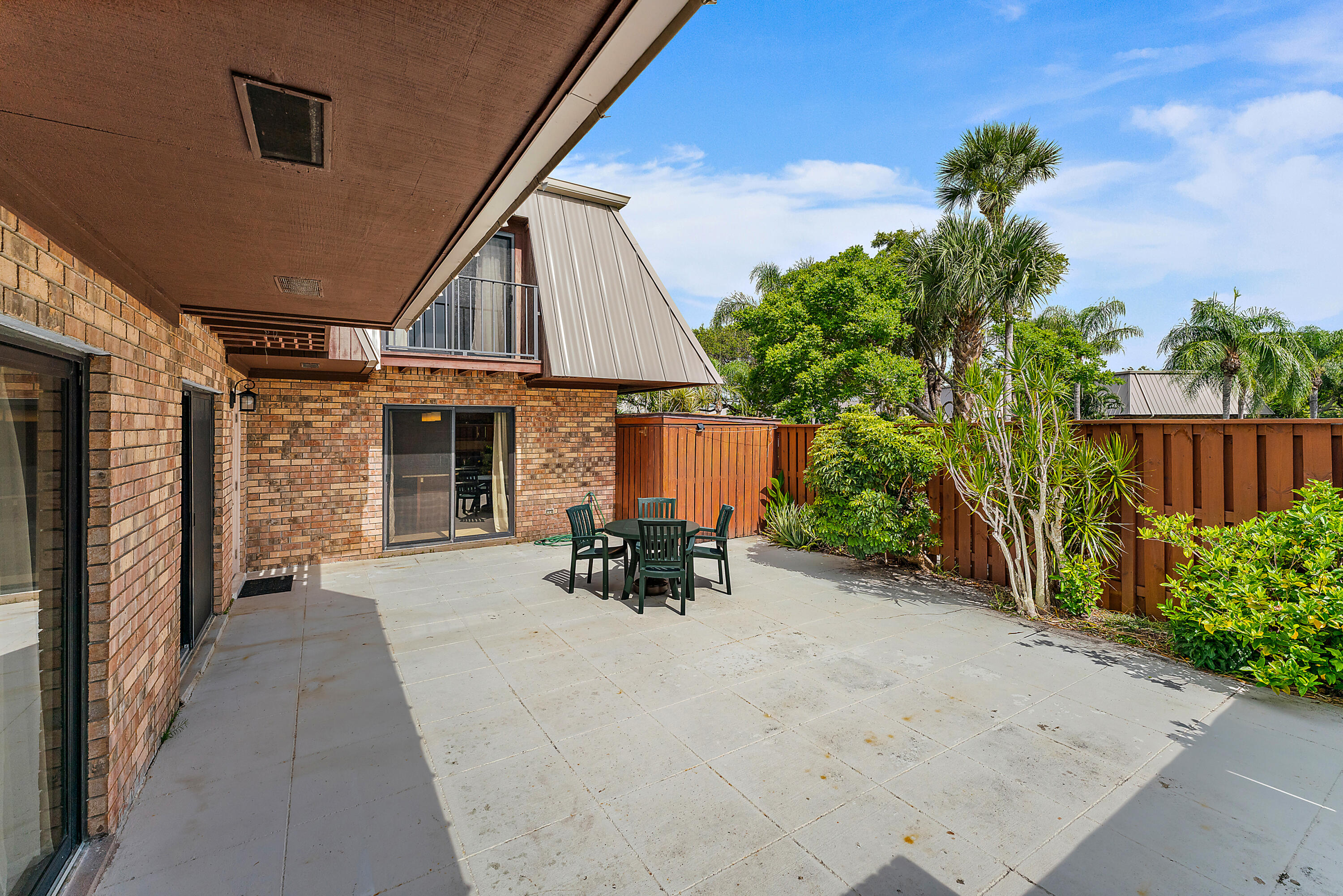 1420 Ocean Way, Unit 14C Jupiter, FL 33477 - Photo 6 of 41 a view of a house with a patio