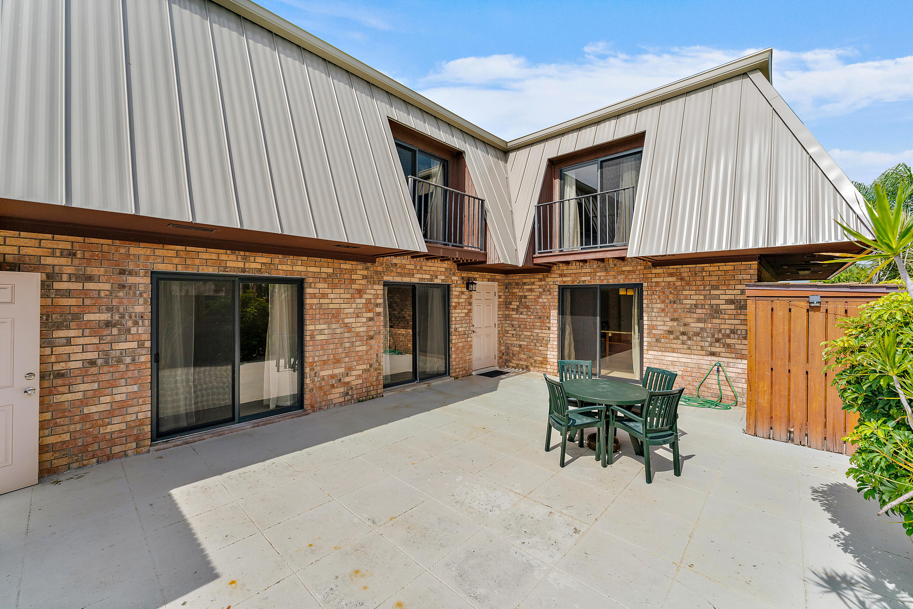 1420 Ocean Way, Unit 14C Jupiter, FL 33477 - Photo 7 of 41 a balcony with furniture and a potted plant