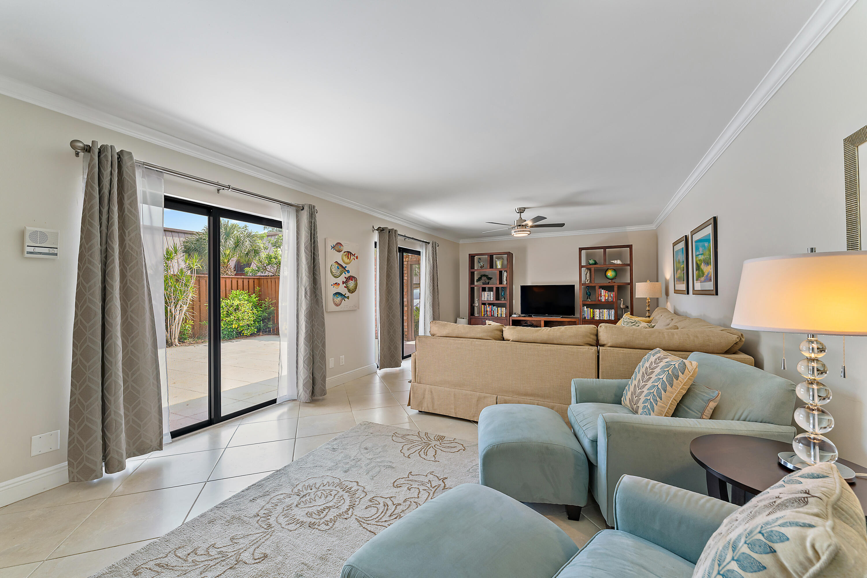 1420 Ocean Way, Unit 14C Jupiter, FL 33477 - Photo 10 of 41 a living room with furniture and a window