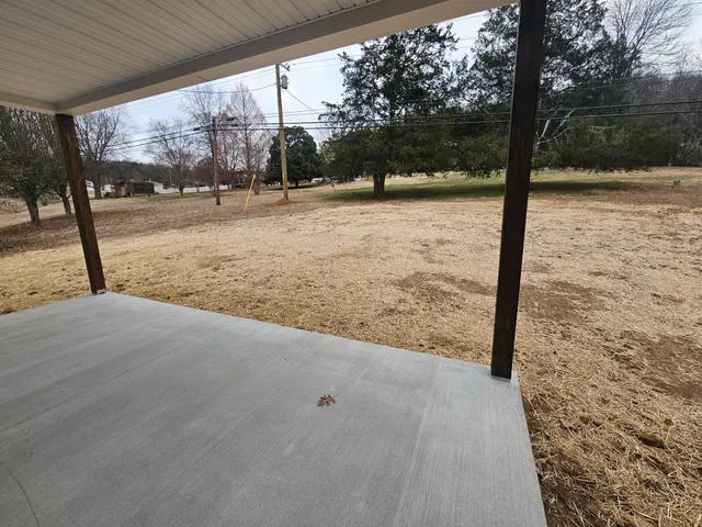 a kitchen with cabinets appliances and a wooden floor