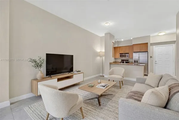 a living room with furniture and a flat screen tv