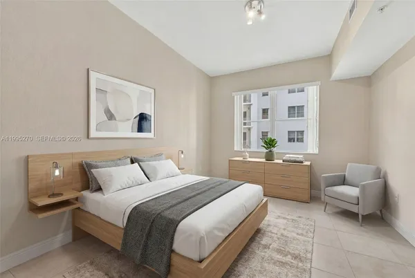 a bedroom with a bed and a couch