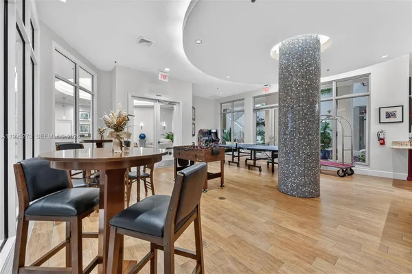 a view of a dining room with furniture and window