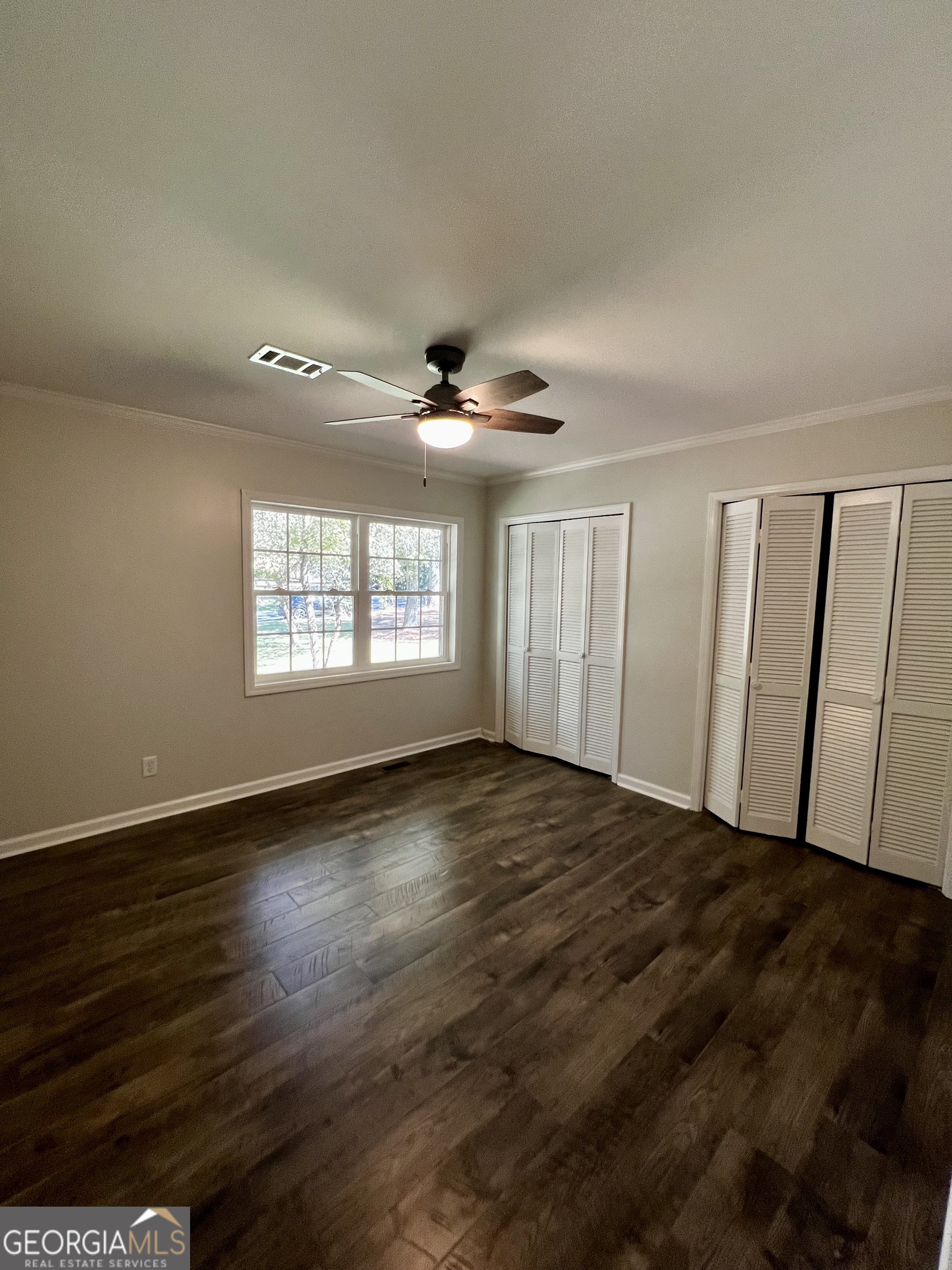 203 Smithfield Road Dublin, GA 31021 - Photo 19 of 44 a view of an empty room with a window