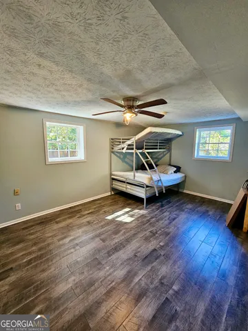 a view of an empty room and wooden floor