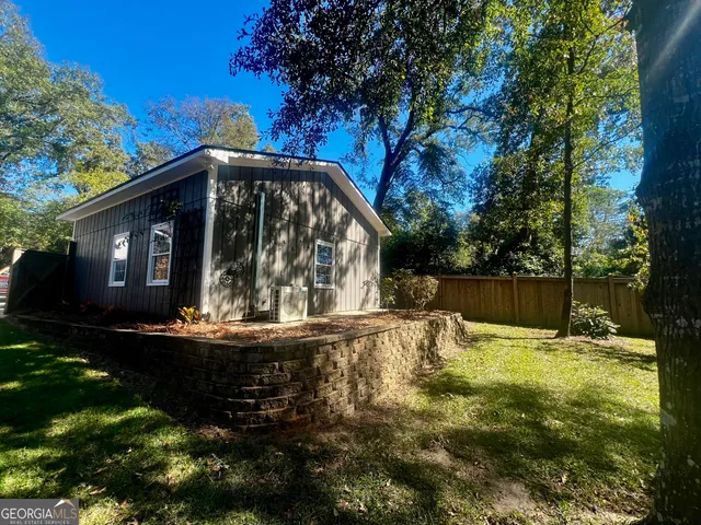 a view of a field with trees