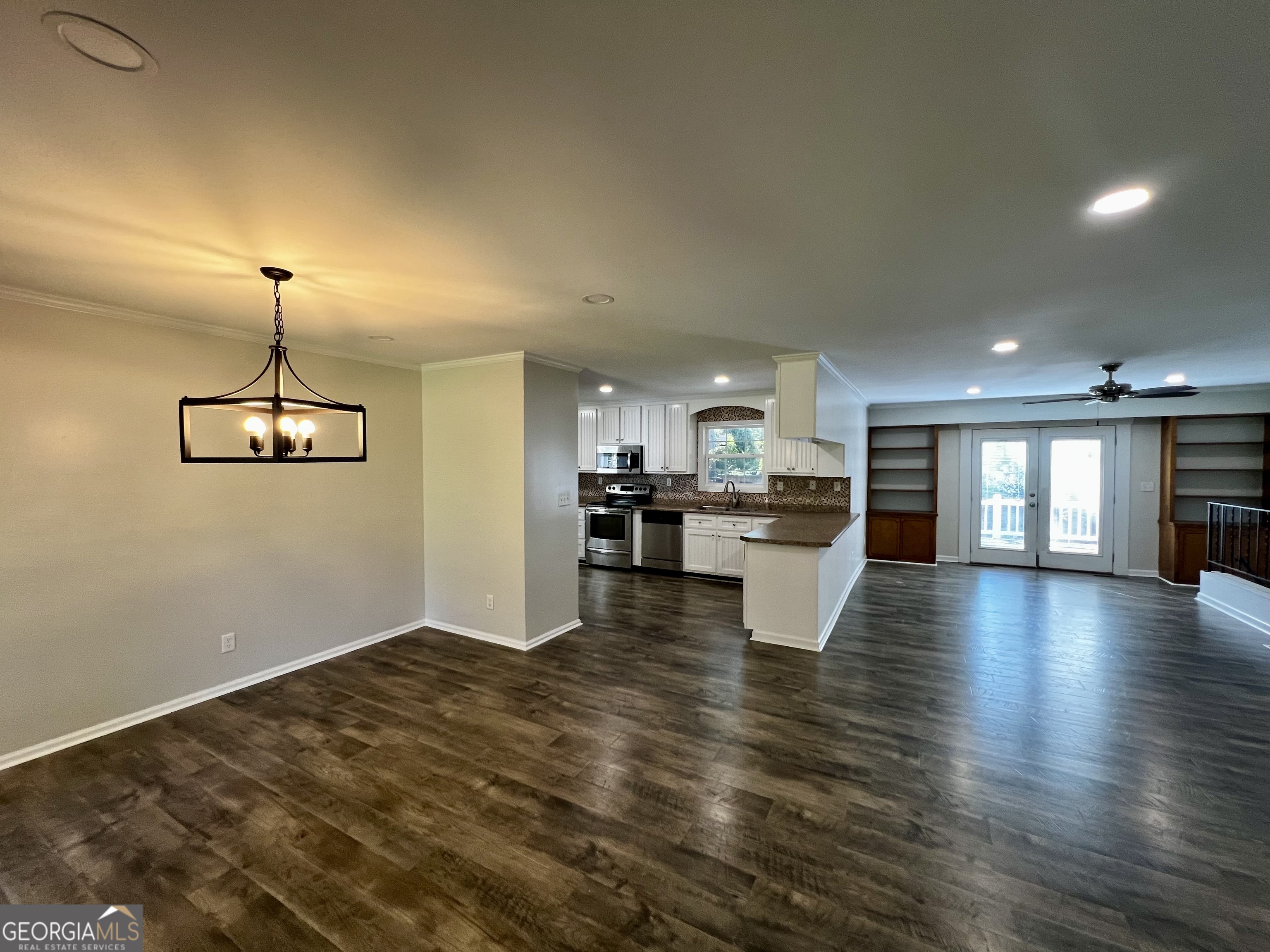 203 Smithfield Road Dublin, GA 31021 - Photo 6 of 44 a view of a kitchen with furniture and wooden floor