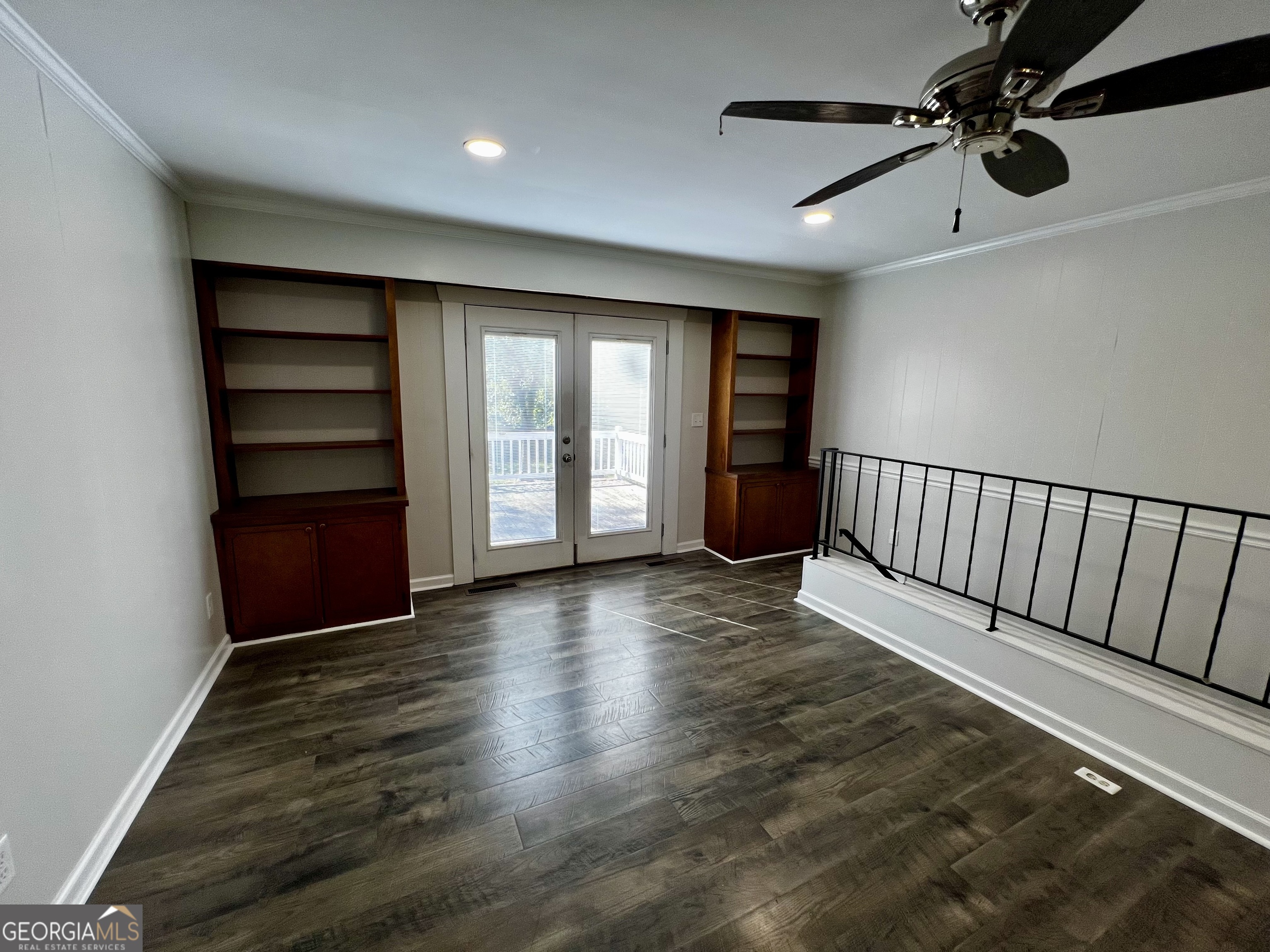 203 Smithfield Road Dublin, GA 31021 - Photo 8 of 44 wooden floor in an empty room with a window