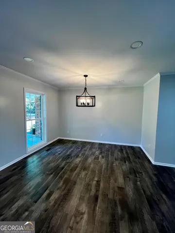 a view of an empty room and window