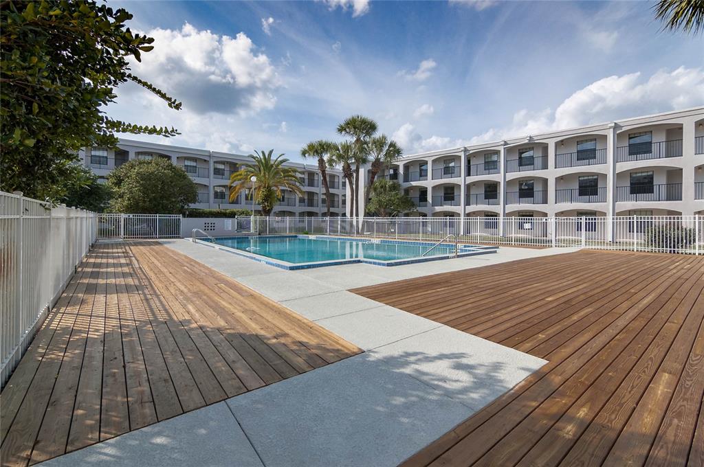 2323 McCoy Road, Unit 711 Orlando, FL 32809 - Photo 9 of 14 a view of a balcony with wooden floor