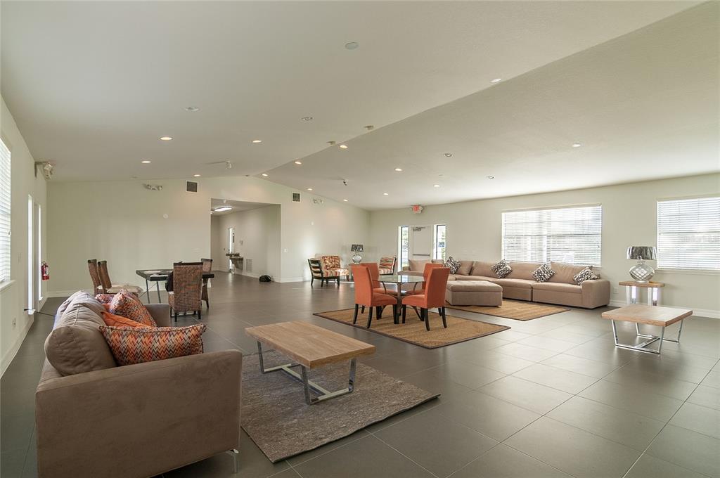 2323 McCoy Road, Unit 711 Orlando, FL 32809 - Photo 10 of 14 a living room with furniture and a large window