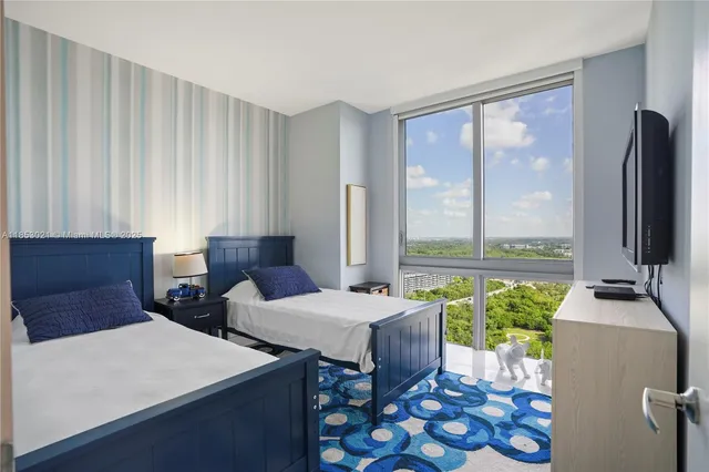 a bathroom with a toilet sink and shower