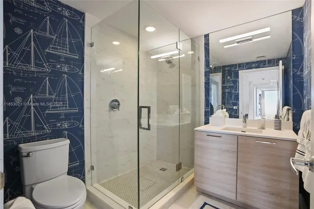 a bedroom with a bed and flat screen tv