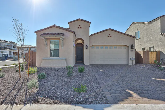 a view of a house with a yard and garage
