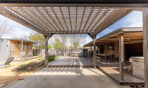 a view of a chairs and table in the patio