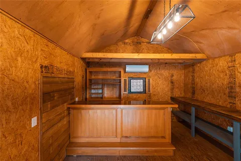 a view of a porch with furniture and floor to ceiling windows