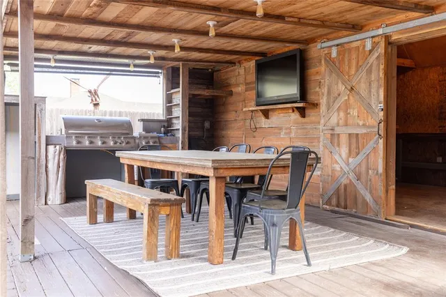 a view of a dinning tables and chairs in the balcony