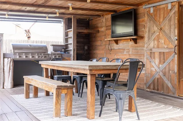 a view of a chairs and table in the patio