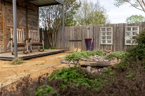a view of a chairs and table in the patio