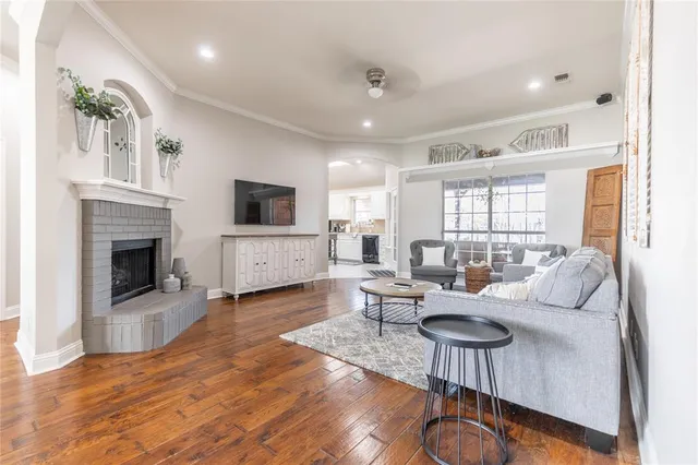 a living room with furniture and a fireplace