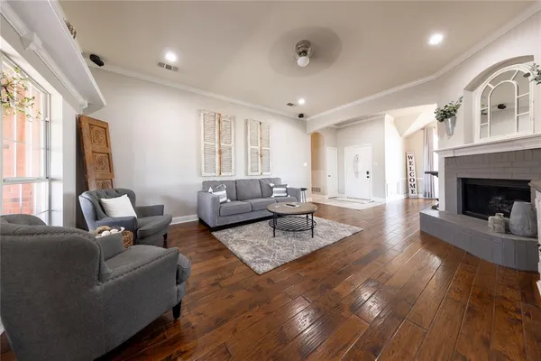 a living room with furniture and a fireplace
