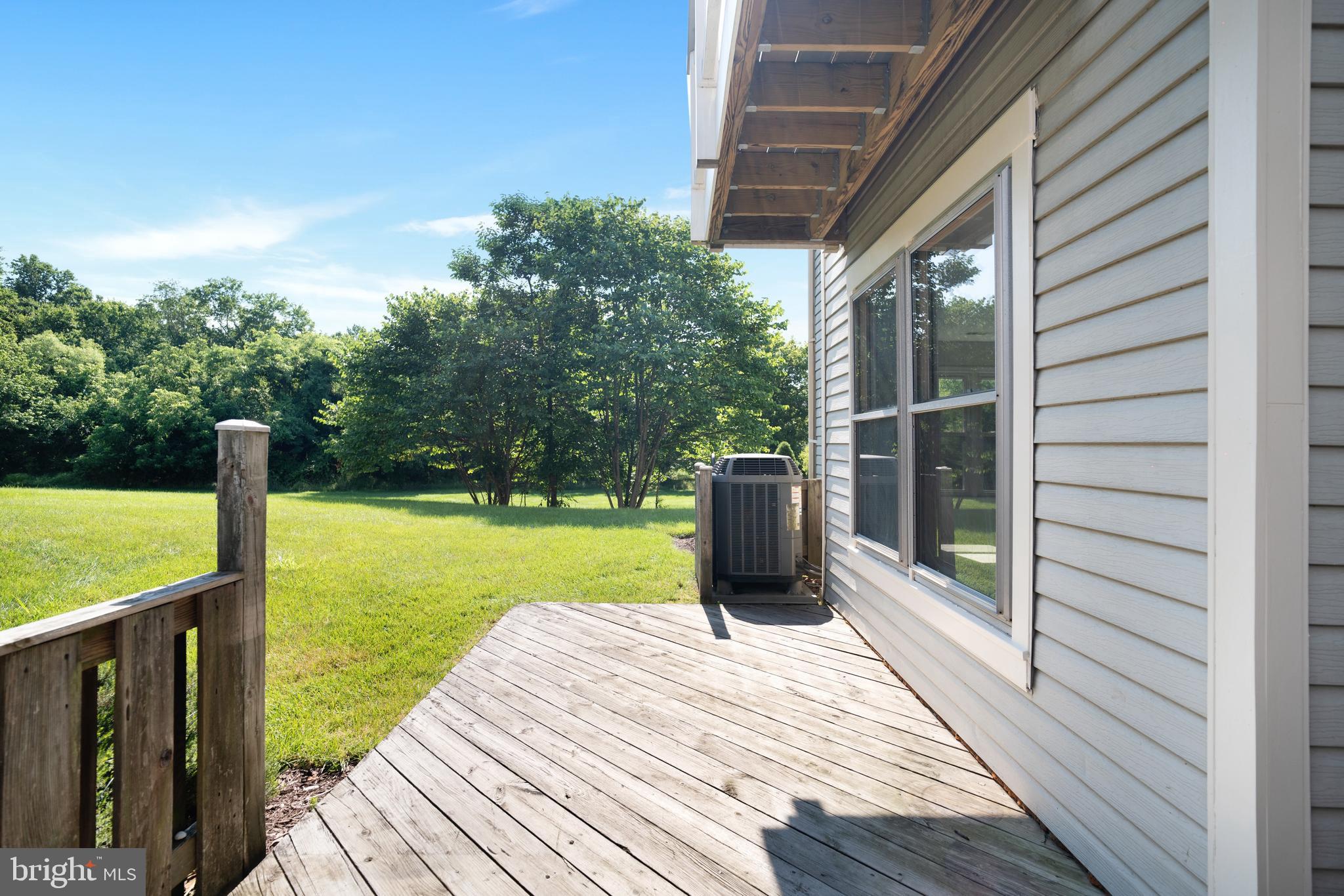 9448 Trevino Terrace, Unit 96 Laurel, MD 20708 - Photo 14 of 38 a view of a deck with wooden floor and sink
