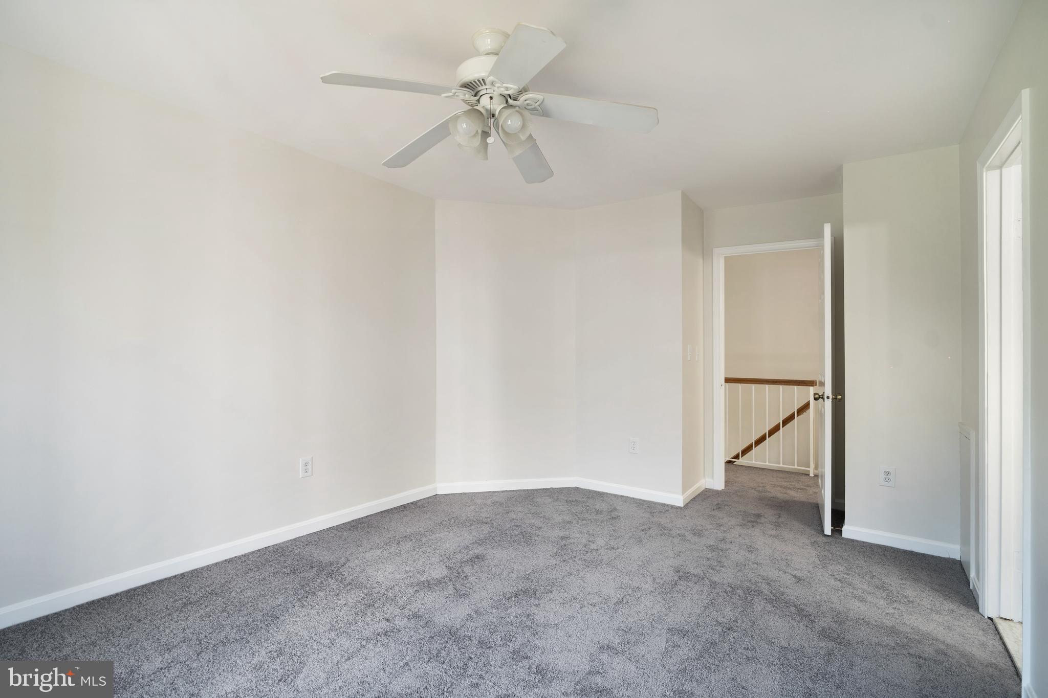 9448 Trevino Terrace, Unit 96 Laurel, MD 20708 - Photo 17 of 38 a view of an empty room with a ceiling fan