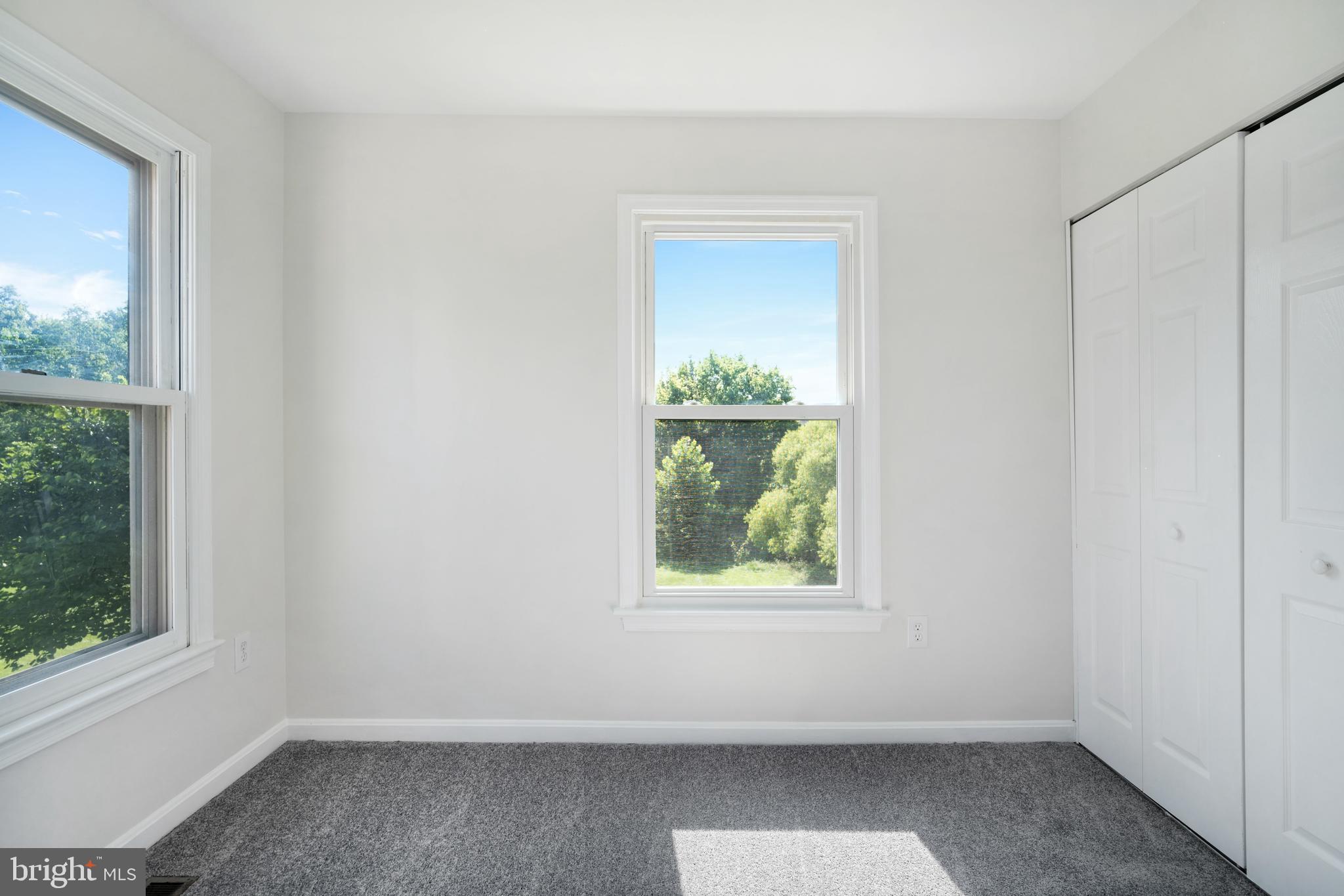 9448 Trevino Terrace, Unit 96 Laurel, MD 20708 - Photo 19 of 38 an empty room with windows