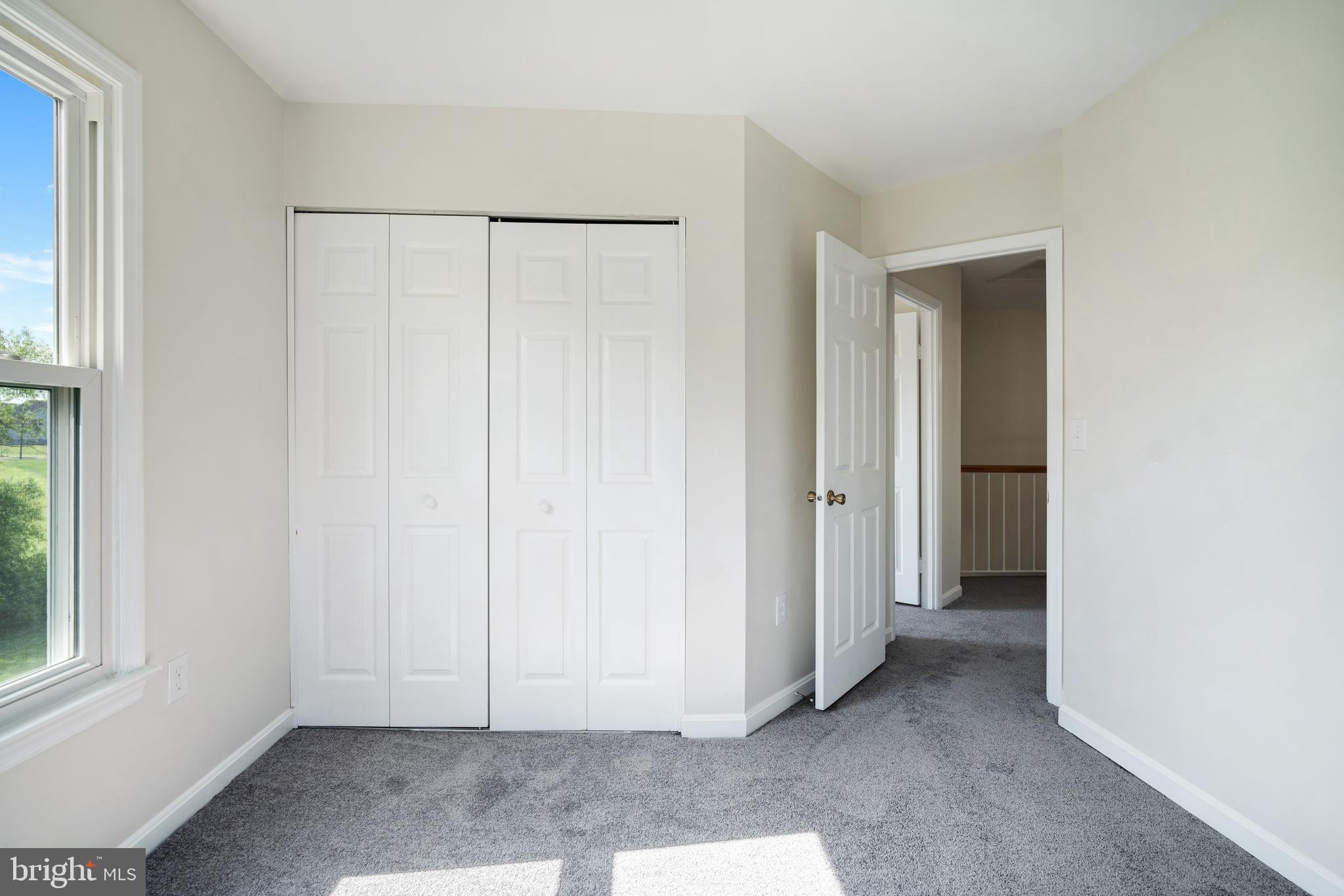 9448 Trevino Terrace, Unit 96 Laurel, MD 20708 - Photo 20 of 38 a view of an empty room with window