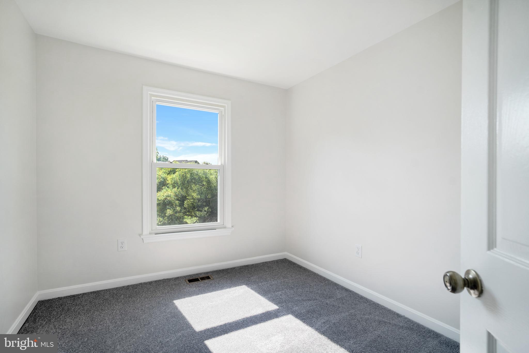 9448 Trevino Terrace, Unit 96 Laurel, MD 20708 - Photo 21 of 38 an empty room with a window